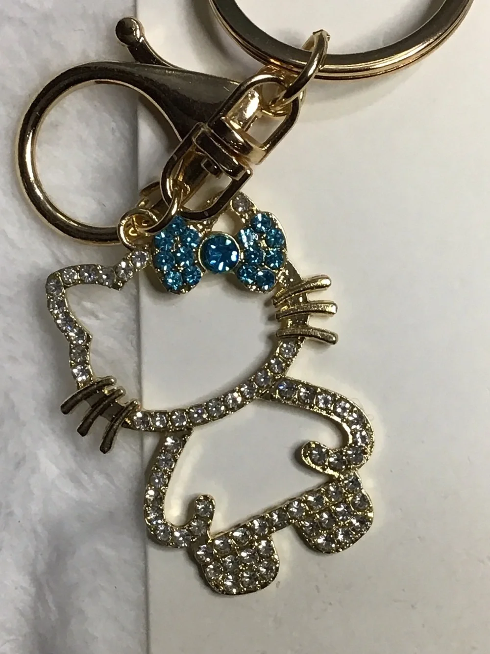 Gold-tone Crystal Cat Keychain with Blue Bow
